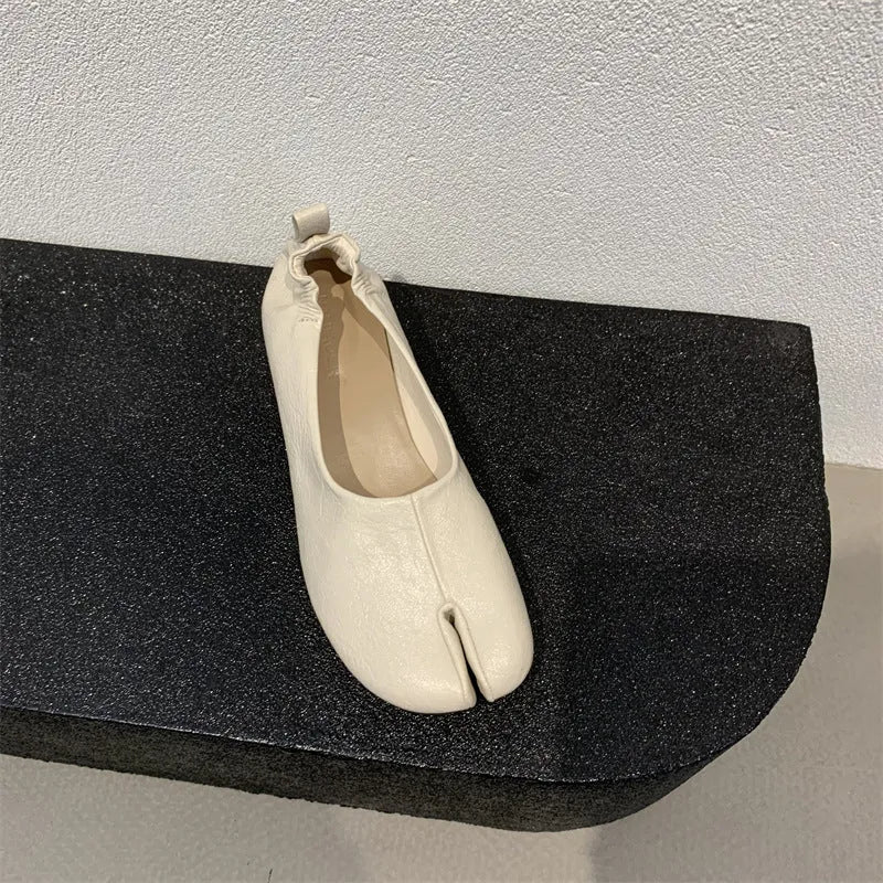 Women's apricot split toe chunky heel pumps with round toe and low heel on a white background.