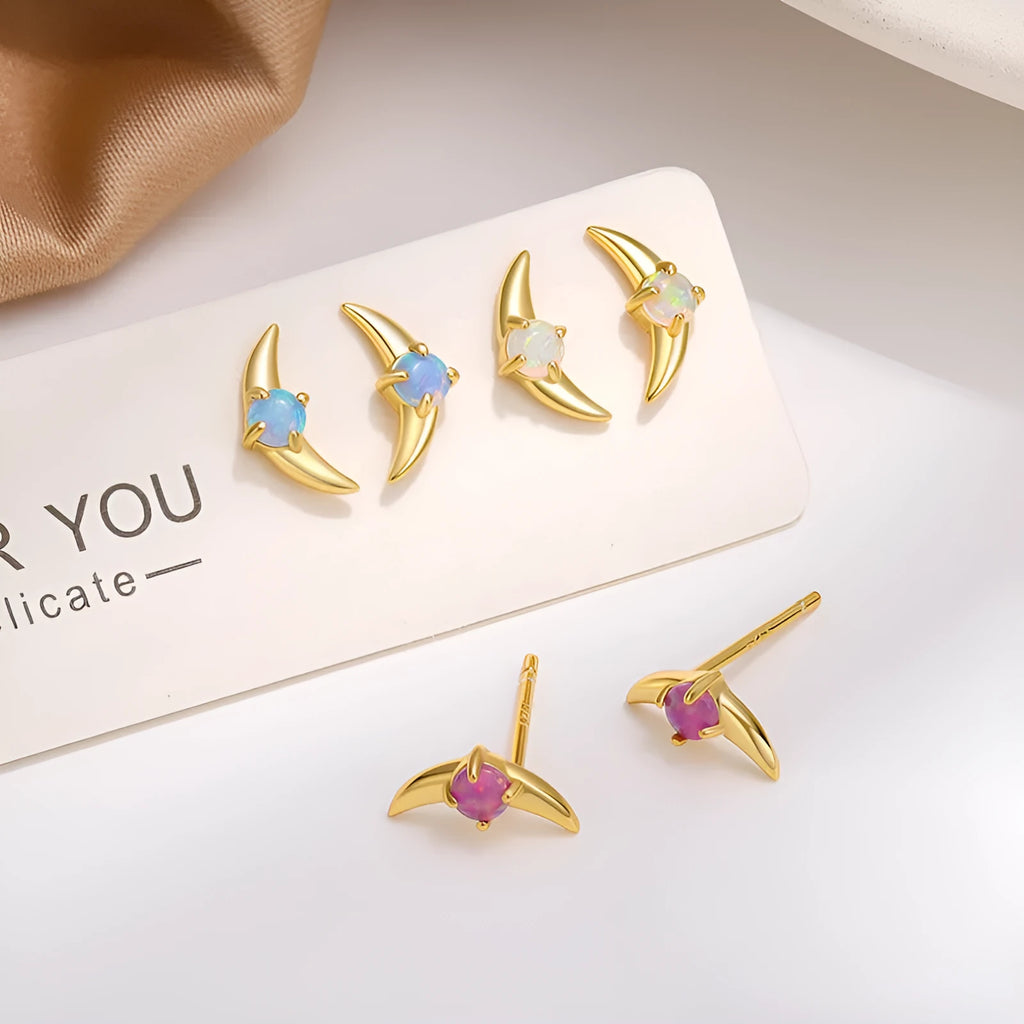 A pair of women's geometric earrings in 925 silver with a blue stone and gold electroplated finish.