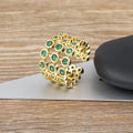 Gold coloured wide band ring with green zircon stones and three-layer copper plating