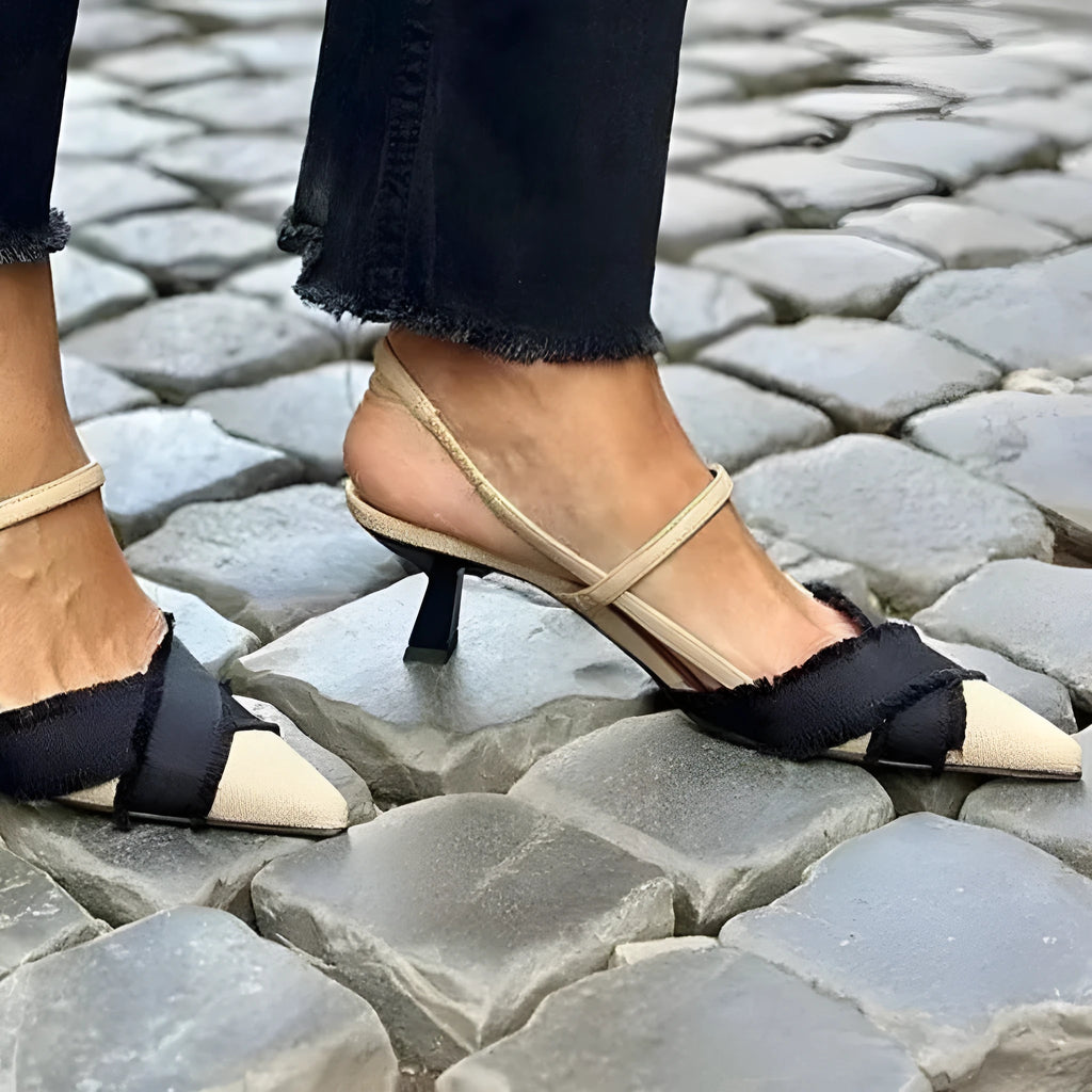 Apricot black women's pointed toe stiletto sandals with a buckle fastening.