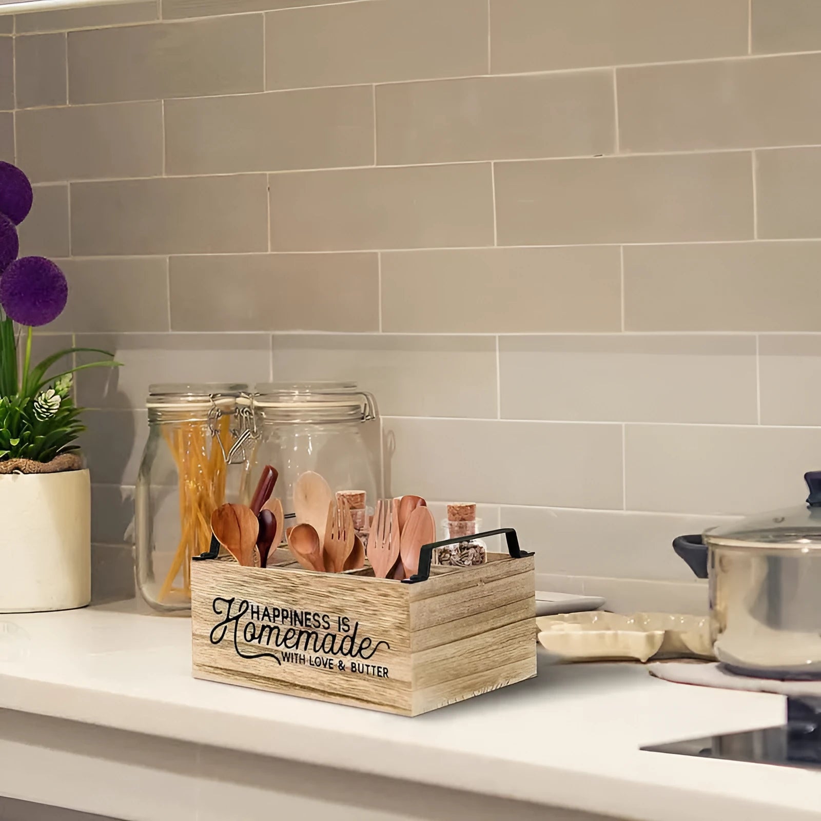 Wooden kitchen tableware storage box with grid dividers showing utensils organised in compartments