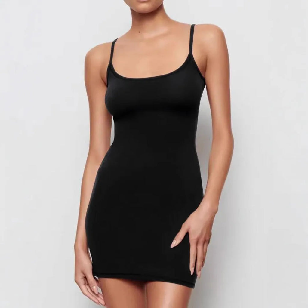 Black sling-style skinny sheath dress with sleeveless design and short skirt.
