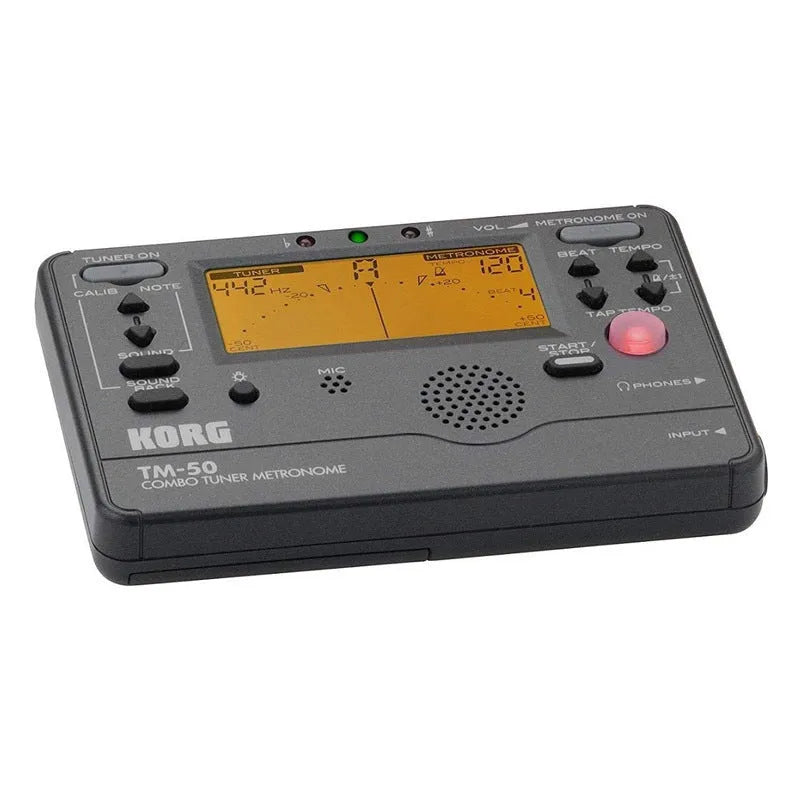TM-60 black and white universal electronic metronome and tuner on a table.