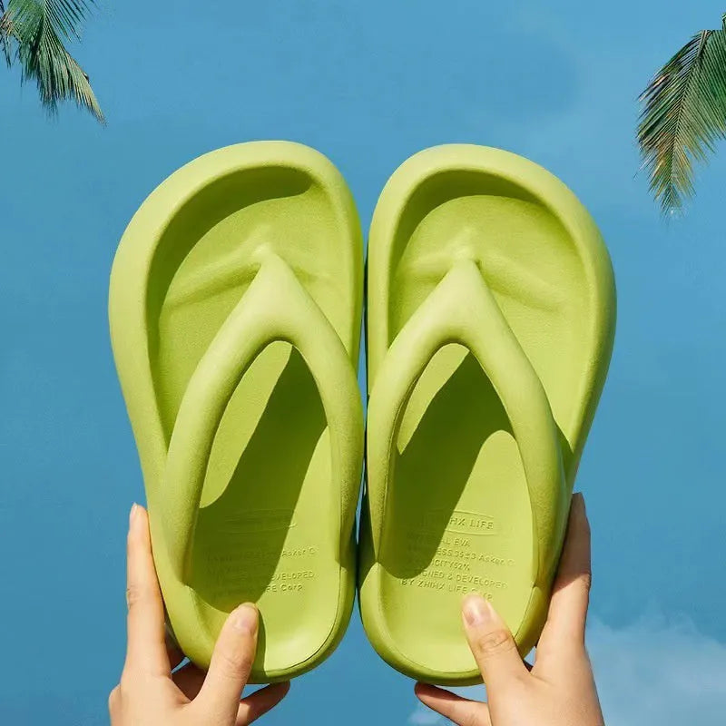 A pair of EVA thick-soled flip-flops with a bow detail on the upper, shown in one of the available colours.
