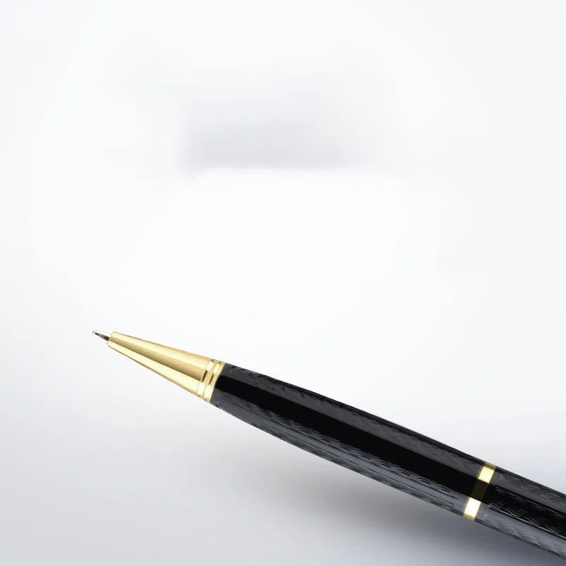 Black pen-shaped digital voice recorder with zinc alloy casing shown next to its accessories.