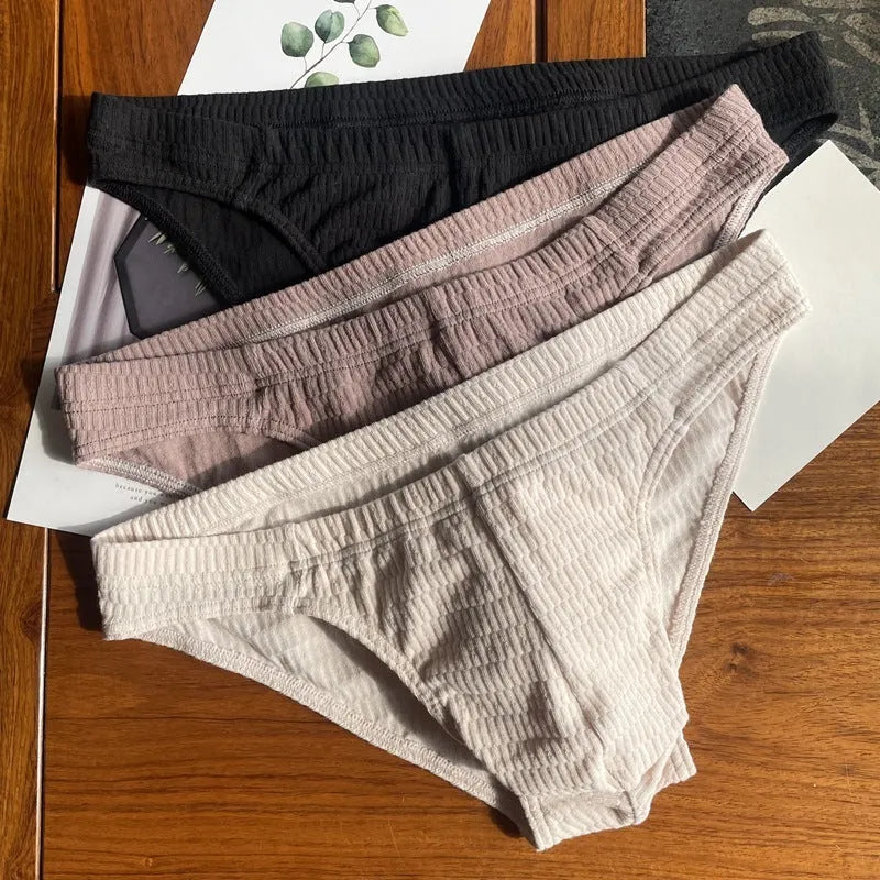 Men's solid colour pure cotton triangle briefs with a mid-waist body-shaping design.
