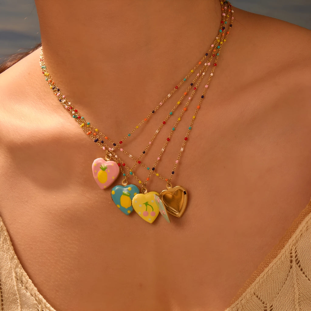 Women's stainless steel necklace with fruit pendant designs in gold plating on adjustable chain