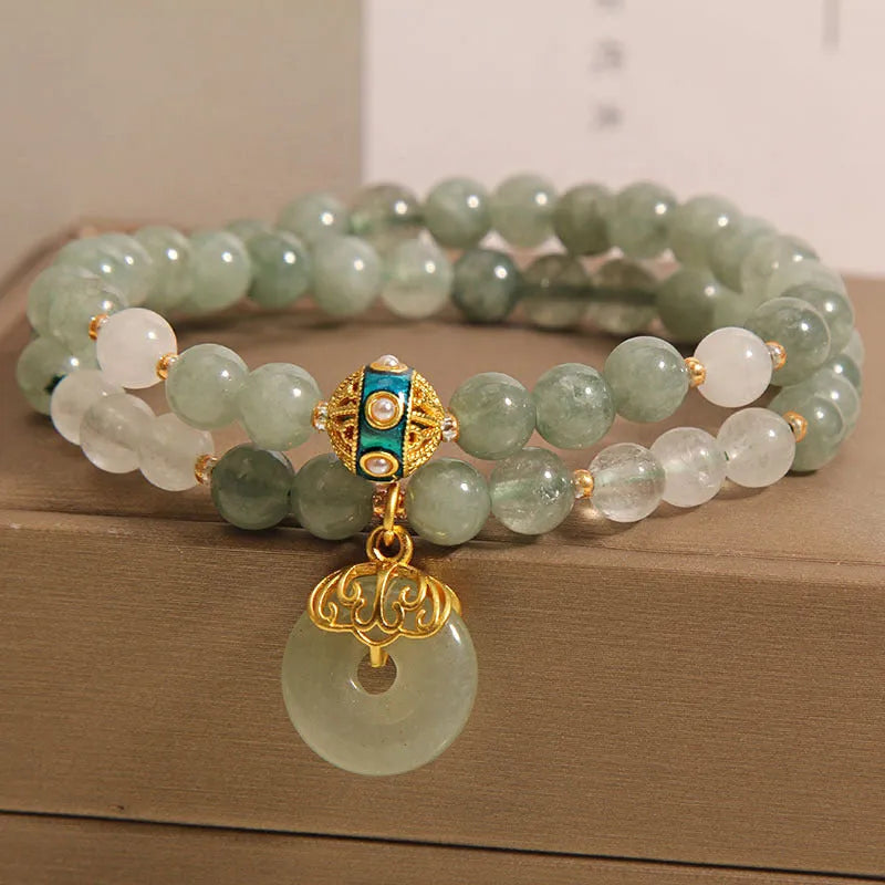 Women's double-layer aventurine jade bracelet with peace buckle closure in emerald green
