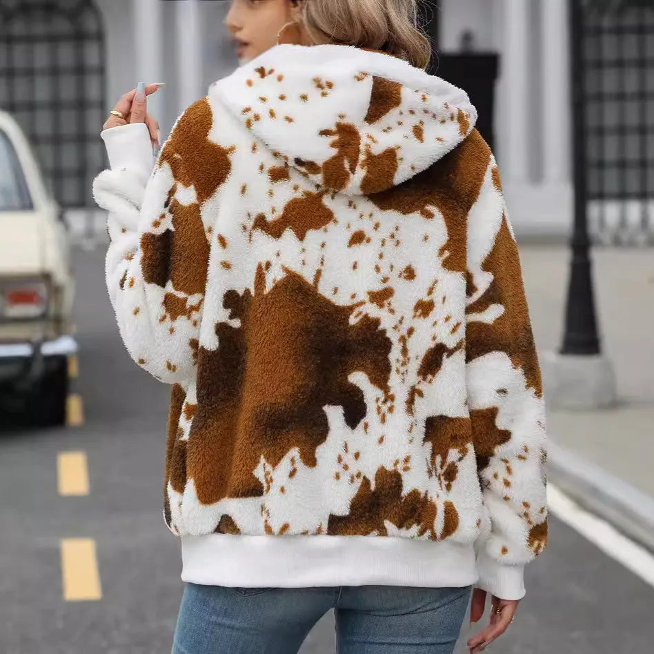 Yellow brown cow print hooded zip-up cardigan jacket on a hanger