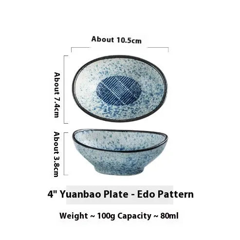Oval Japanese ceramic sauce dipping bowl with underglaze finish on a table.