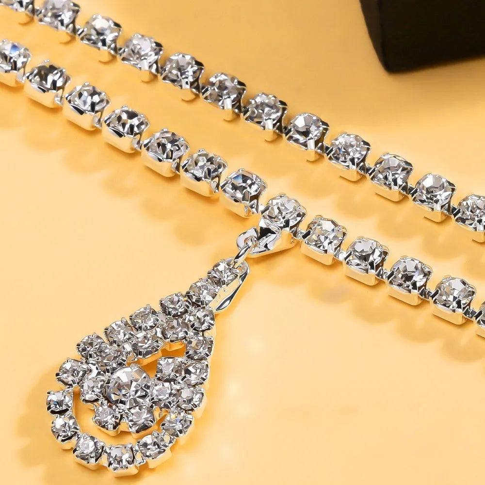Gold or silver water drop pendant waist chain for women with rhinestone and tassel accents, lobster clasp