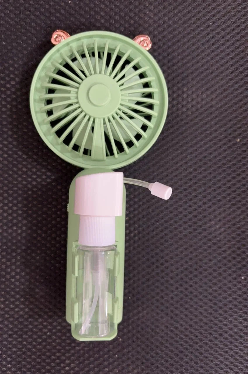 Small plastic nozzle fan in apricot colour with USB charging port