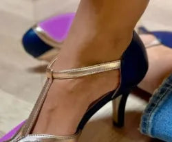 Women's round toe high heels in large sizes with button closure, shown in light blue pink colour.