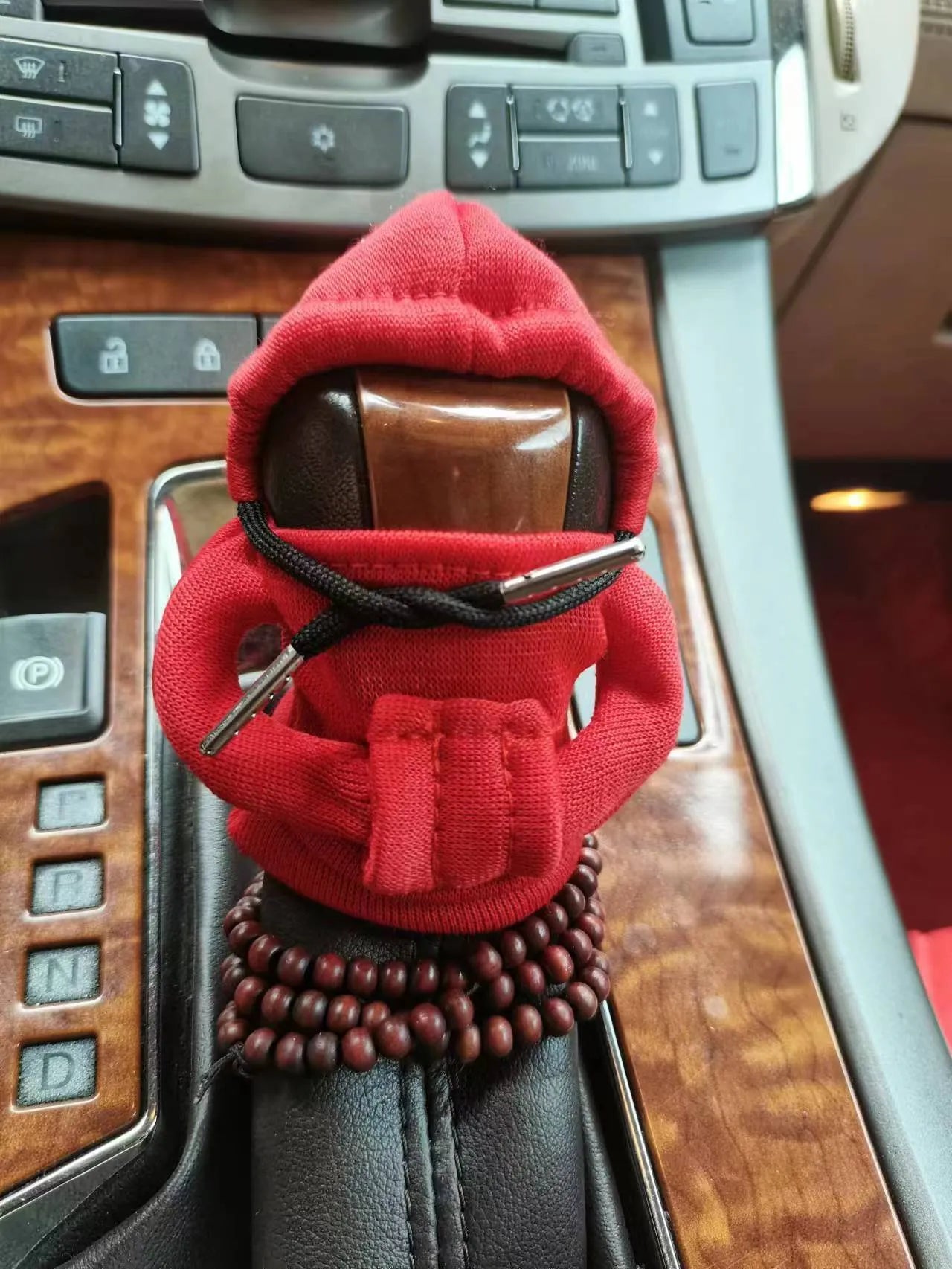 Dutch velvet car gear handle sleeve cover in multiple colours on a car gear lever.