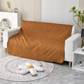 Reversible dog blanket sofa cover in burgundy colour protecting a leather couch from pet damage