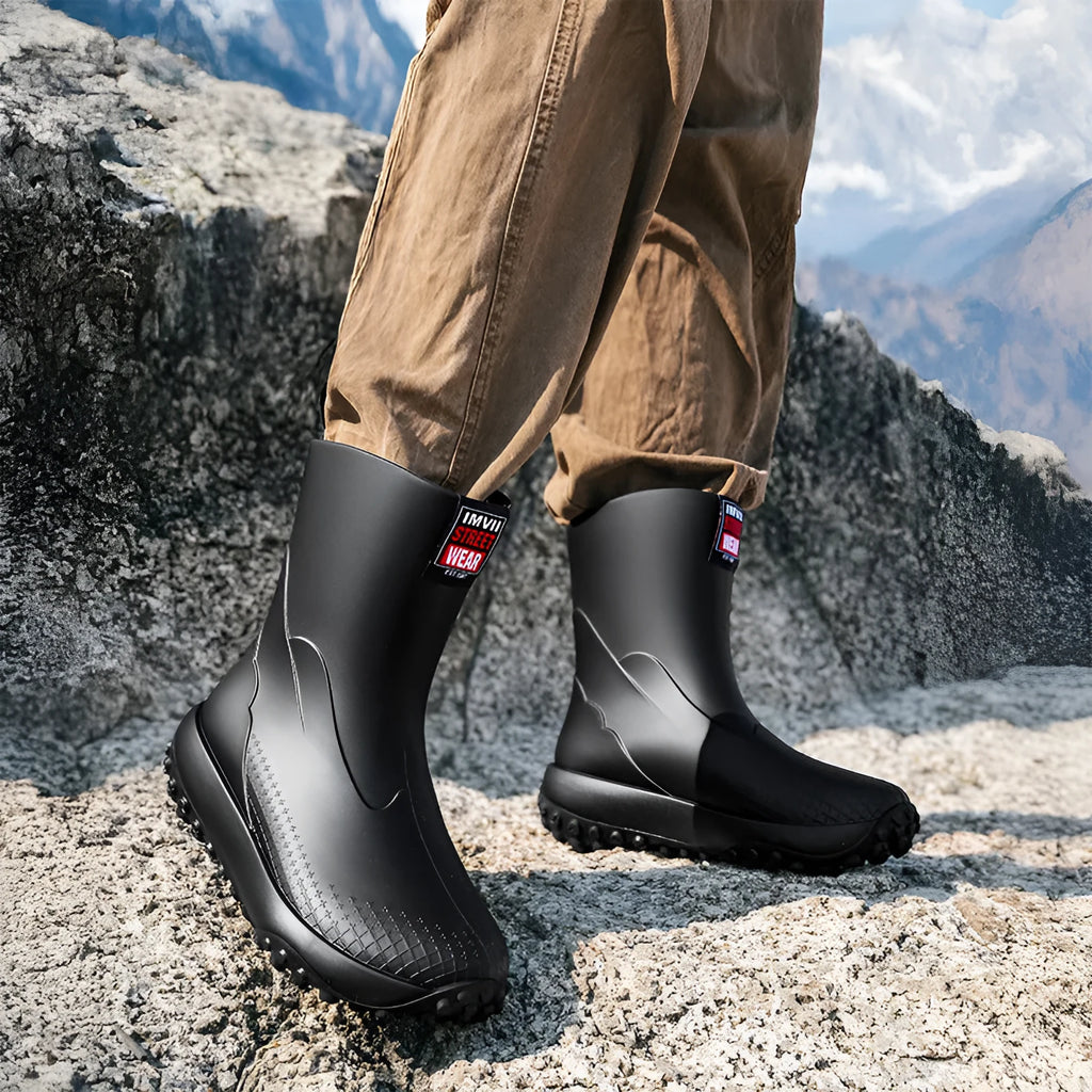 Men's mid and low tube rain boots in black, waterproof PVC with non-slip plastic sole on wet ground