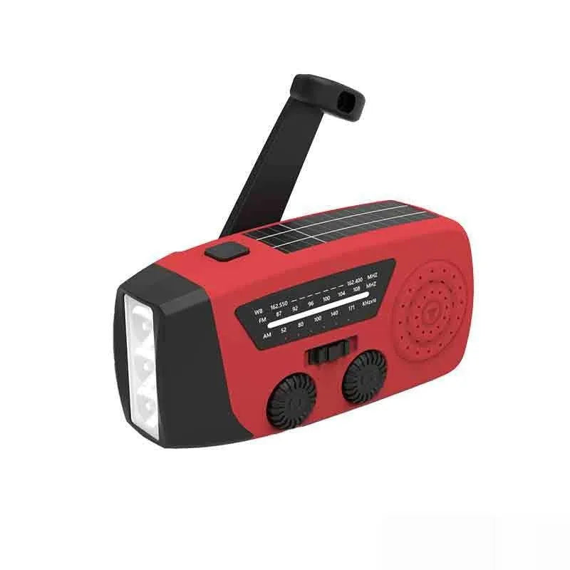 Red rechargeable handheld torch and radio unit with wrist strap and USB charging port.