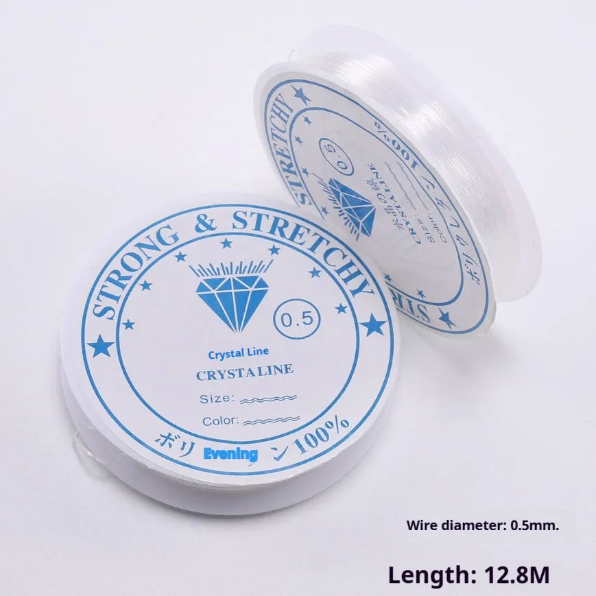 Clear white elastic fishing line on a reel for jewellery making and DIY crafts