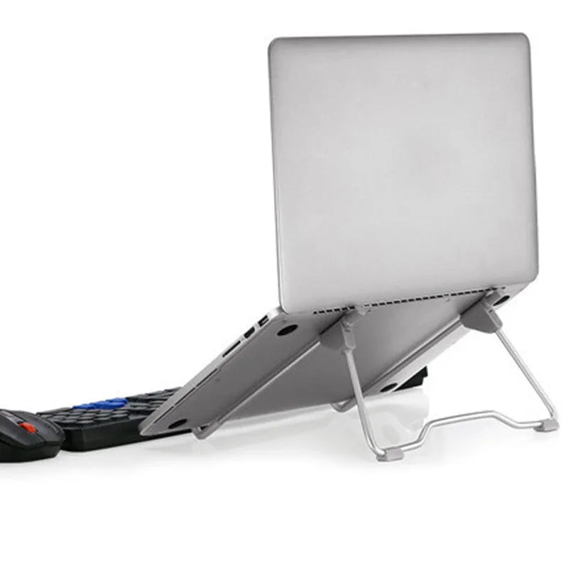 Grey aluminium alloy and engineering plastic mobile phone laptop stand on desktop