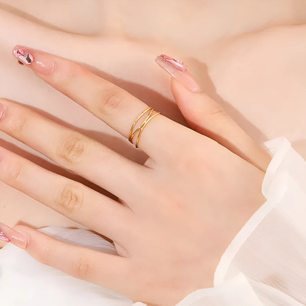 Gold geometric line ring with three-layer coil design on titanium steel band
