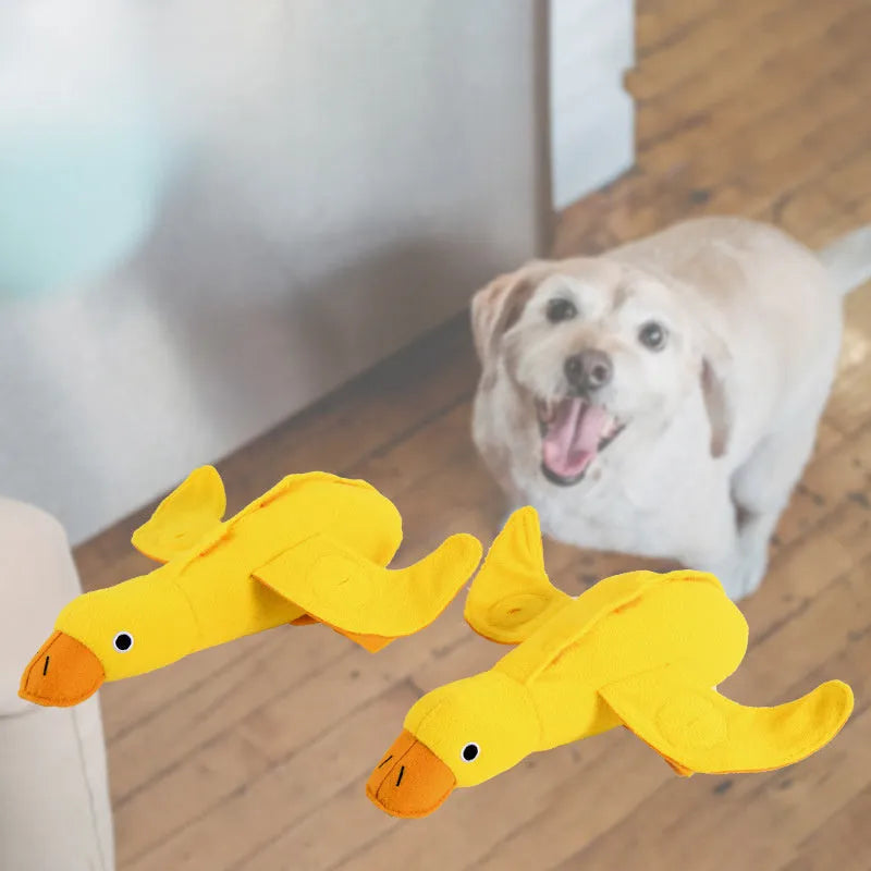 Yellow teddy bear dog toy with duck sound and treat compartments for training