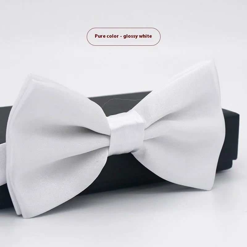 Men's flat head style polyester bow tie in a solid colour, shown with adjustable neck strap.