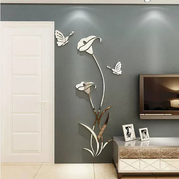 3D acrylic lily wall sticker in silver colour, showing its raised silhouette against a plain wall.