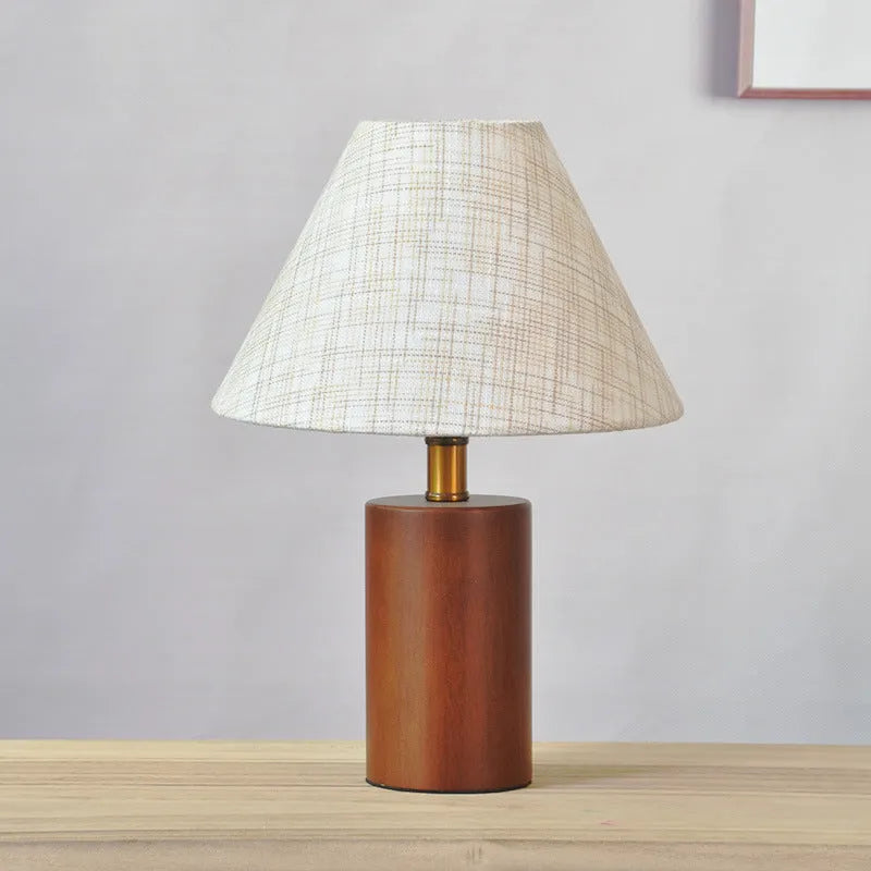 Brown cylindrical wooden bedside lamp with beige cover and E14 bulb base