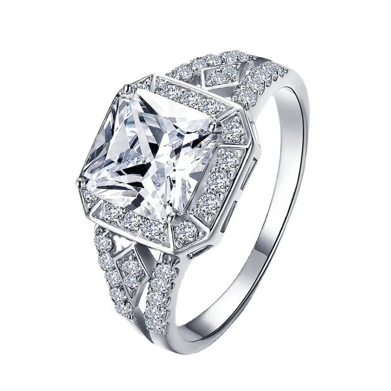 Platinum finish geometric zircon ring with hollow design and quadrilateral patterning