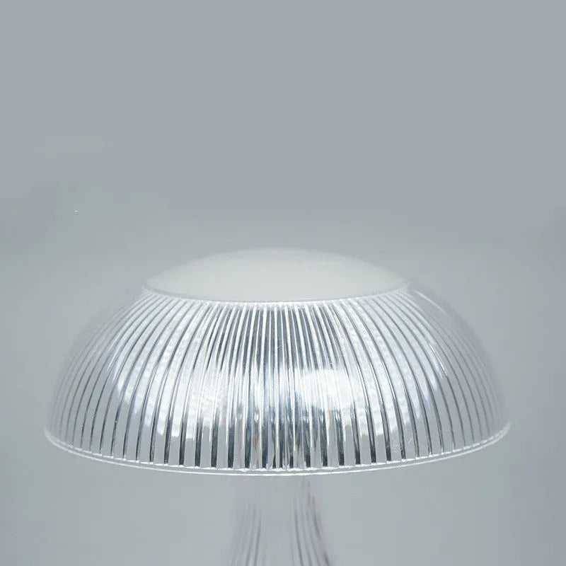 USB rechargeable bedside lamp with touch control and three-colour LED light on tabletop