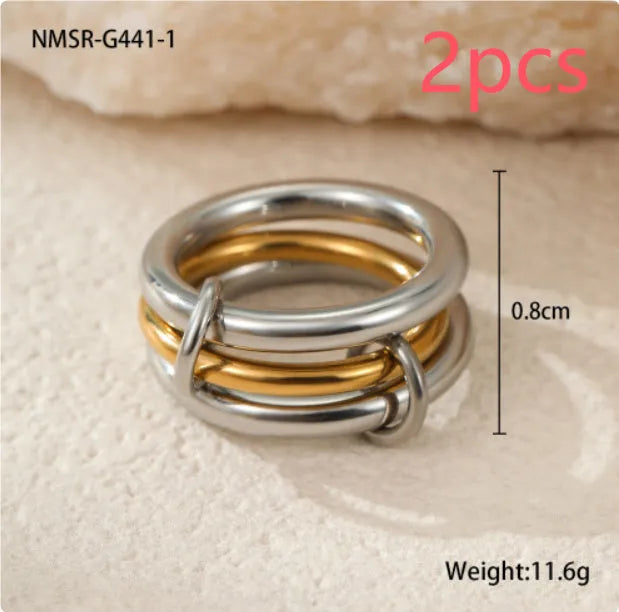 Gold plated exaggerated stackable ring for women on a hand, showing layered jewellery style.