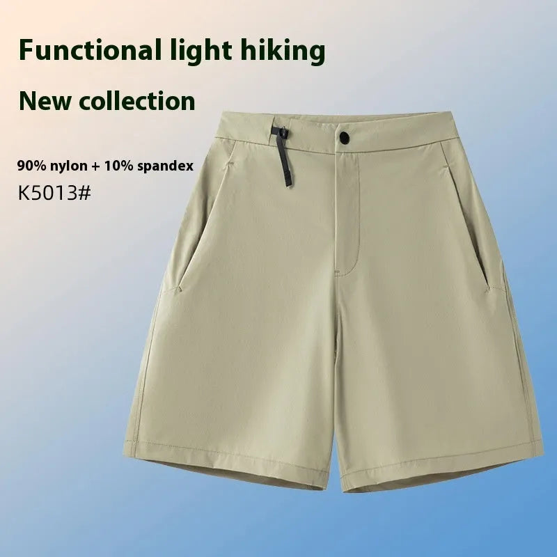 Men's solid colour quick-dry sports shorts with elastic waistband on a grey background.