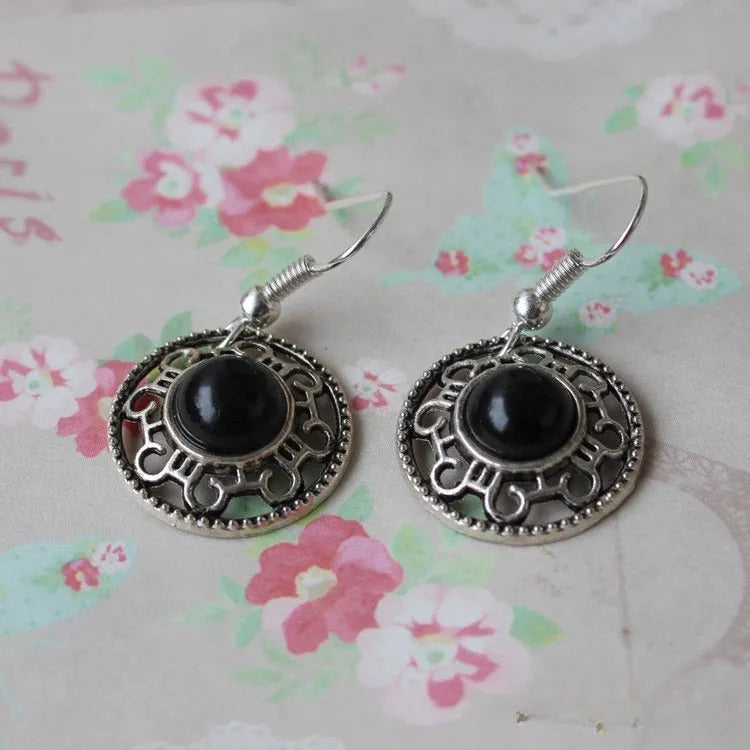 Handmade Miao silver ethnic earrings with turquoise stones in geometric flower disk design
