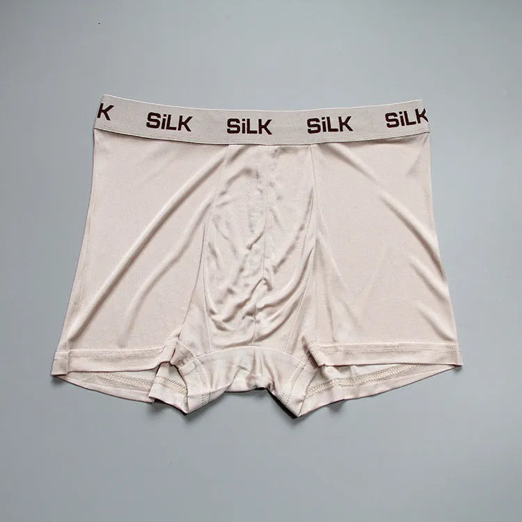 Men's loose fit silk shorts in navy blue, silver grey, and skin colour options