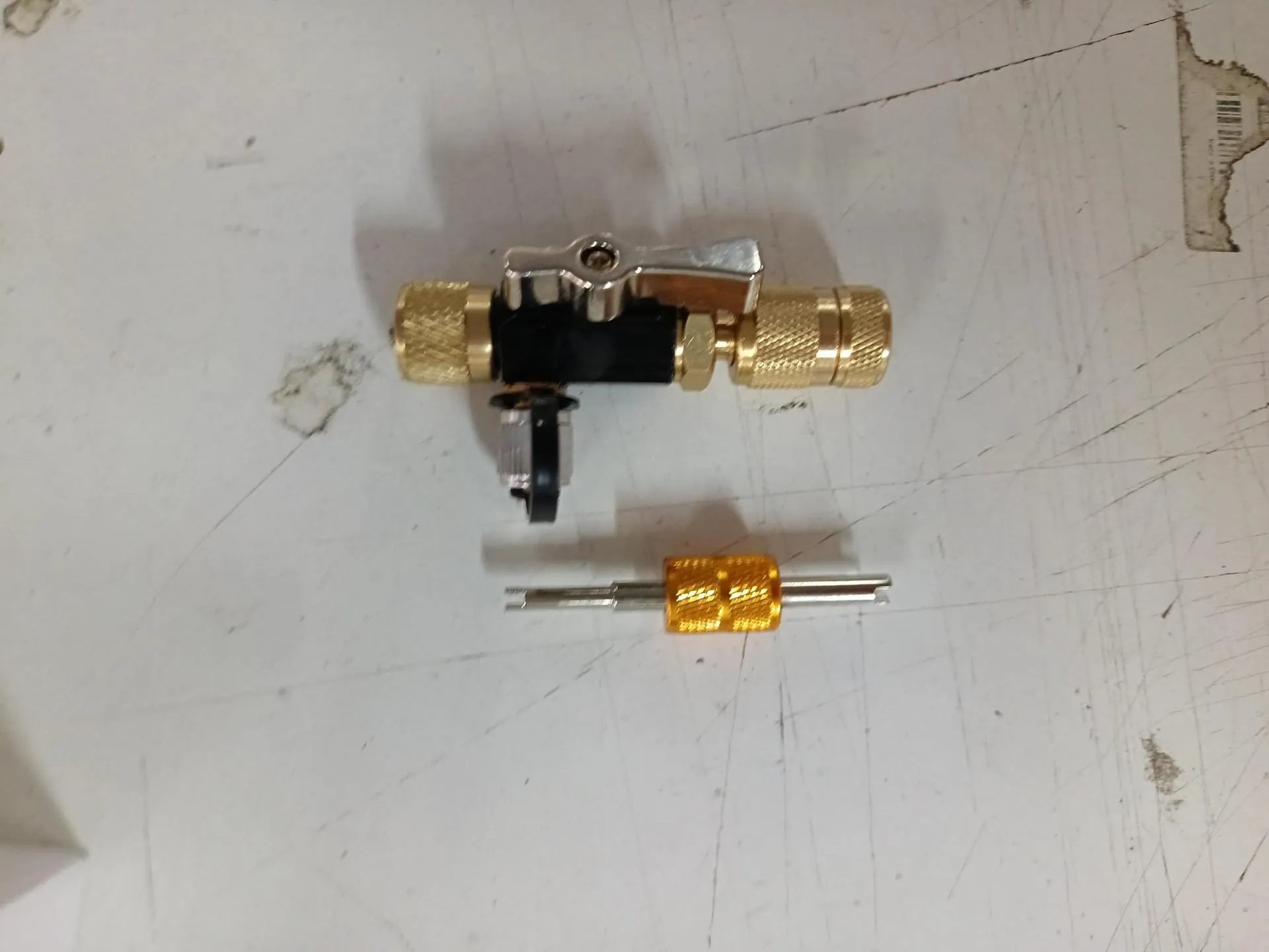 Vacuum valve core disassembly tool set with black and pink metal tools for 1/4-inch and 5/16-inch valve cores
