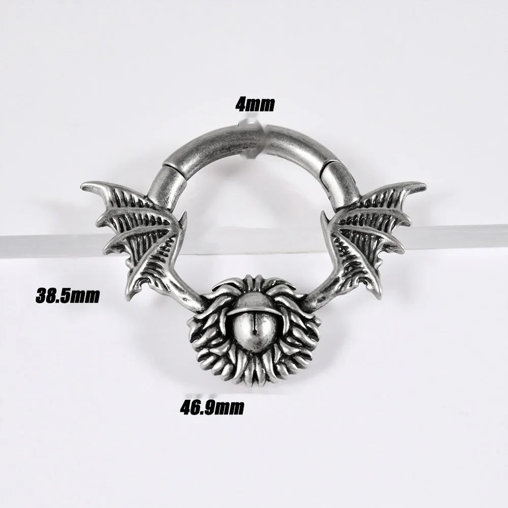 A pair of geometric cone and round shaped copper ear cuffs with magnetic clip-on fasteners.