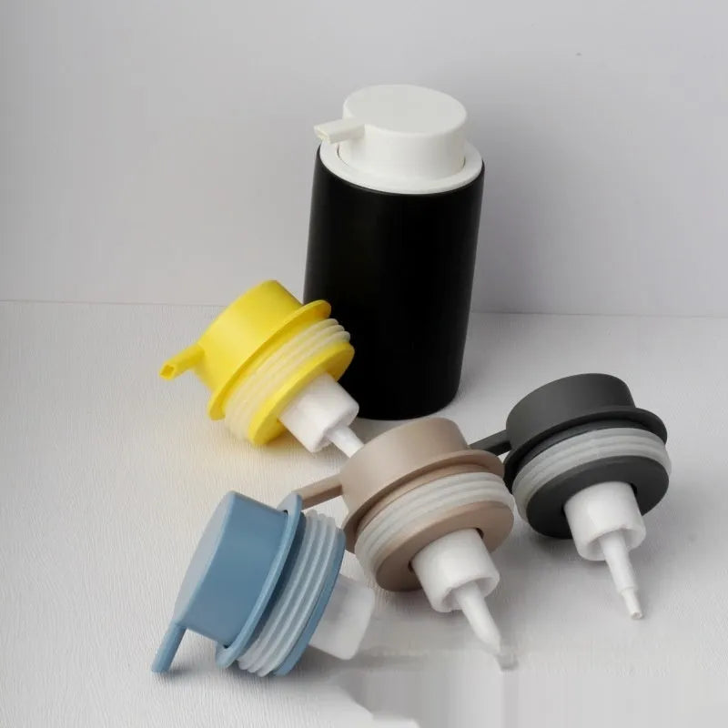 Large plastic foam pump dispenser for facial cleansers in a metallic gold finish