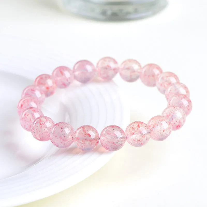 Strawberry quartz crystal bracelet with round 10mm beads on stretch cord