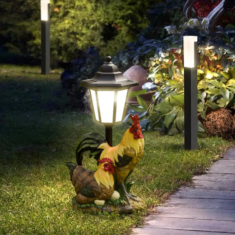 Solar hexagonal garden lamp with decorative resin figurine on plastic base for outdoor pathway lighting