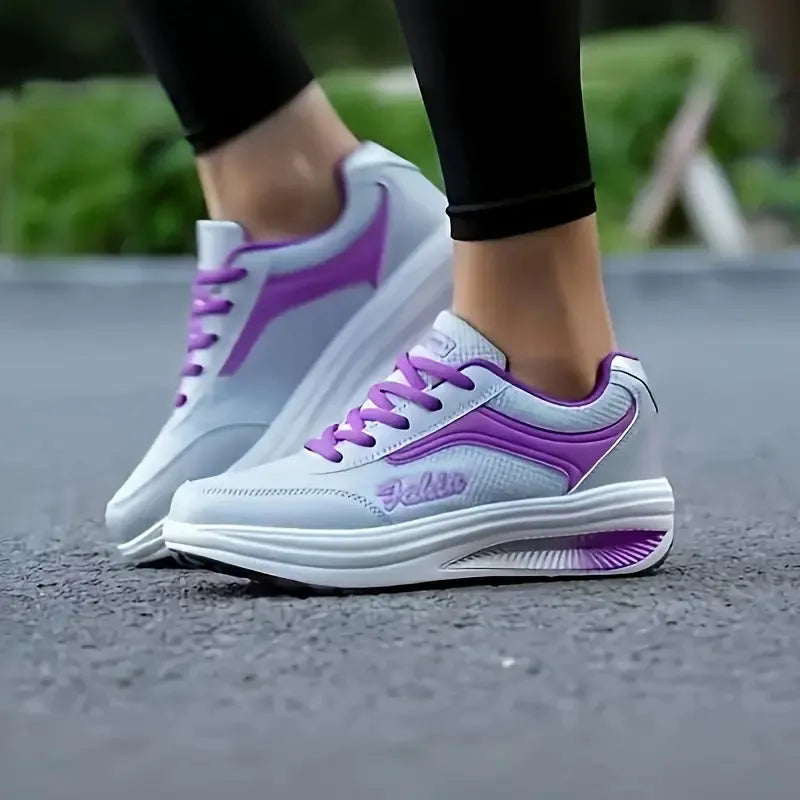 Women's grey powder mid-heel heelless travel and sports shoes on a white background.