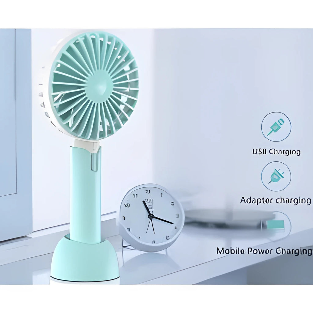 Blue mini handheld USB electric fan with three-speed control on a desk.