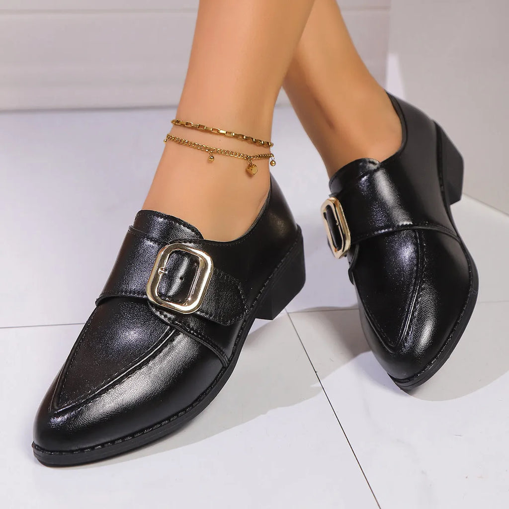 Women's British-style leather-look shoes with decorative bow detail on pointed toe