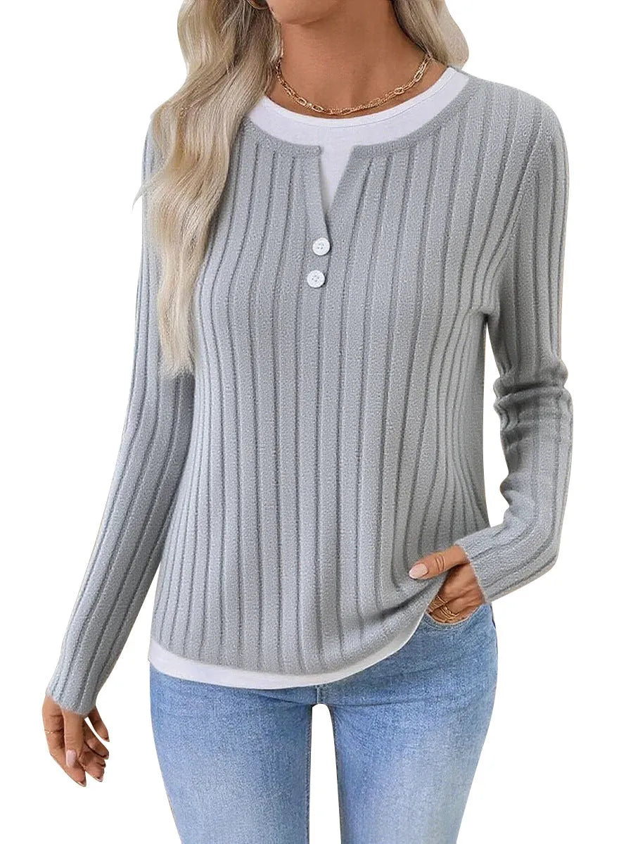 Women's black fake two-piece round neck pullover sweater with long sleeves.