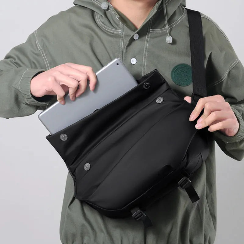 Men's grey medium crossbody sling bag showing internal phone and document compartments