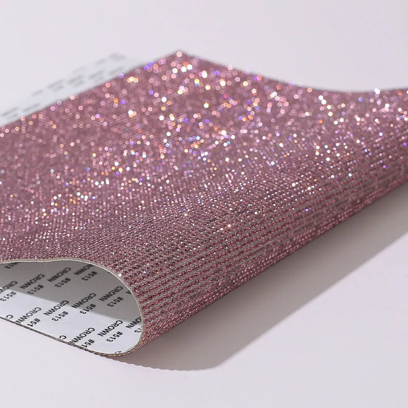Rhinestone transfer sheet with hot fix glue backing showing eight-eye pattern in multiple colour options