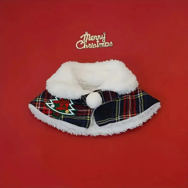 Pet wearing red Christmas cloak with bell design, draped over back with festive snowflake pattern