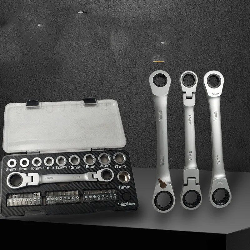 Ratchet wrench set with multiple sockets and bit heads arranged on a workbench