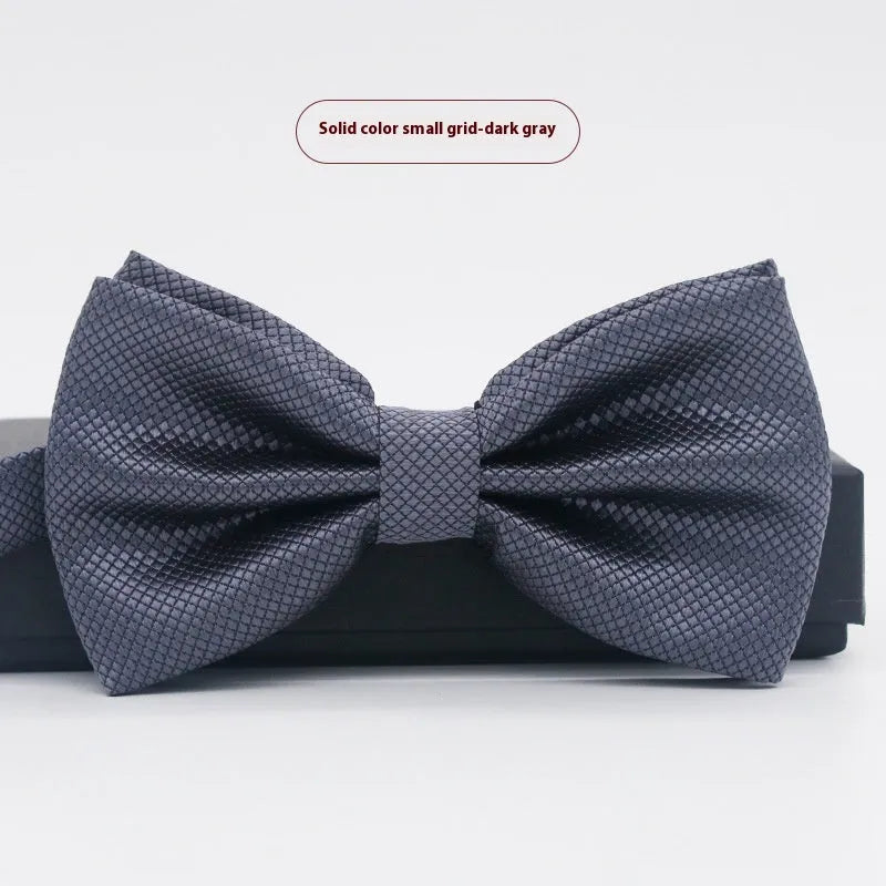 Men's flat head style polyester bow tie in a solid colour, shown with adjustable neck strap.