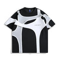 Man's black short sleeve T-shirt showing detail of double stitching and padded shoulder on a hanger.