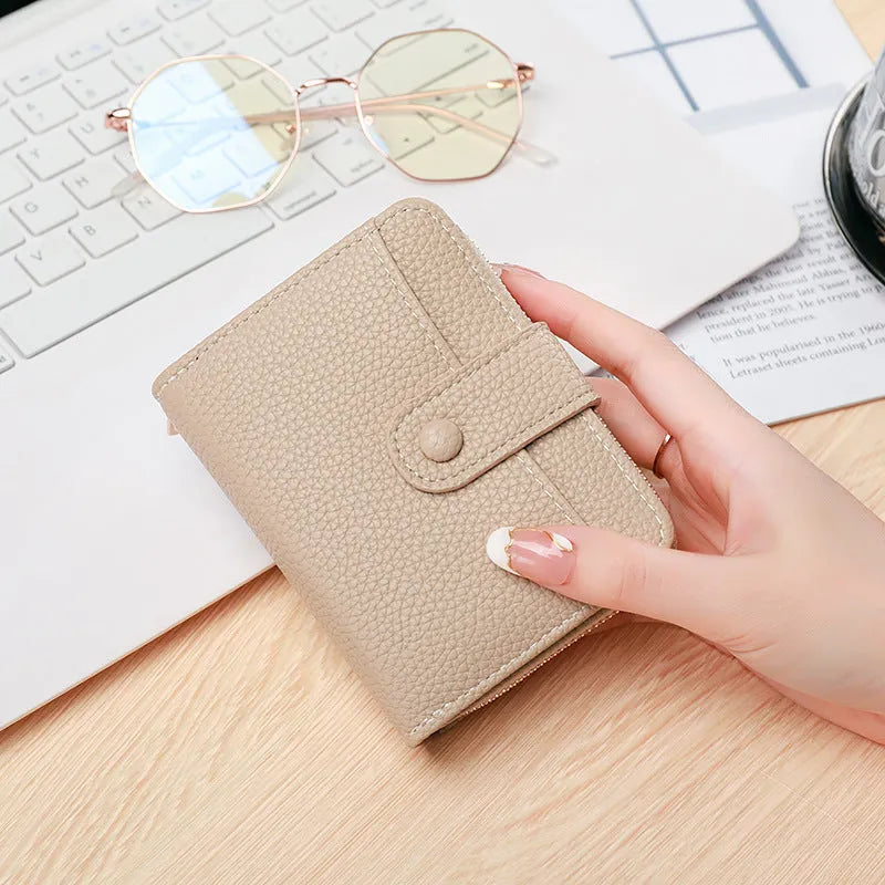 Ladies' short wallet with lychee pattern in beige, pink, black, and red colour options showing two-fold design
